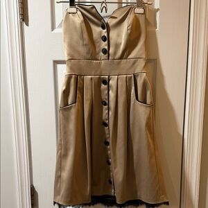 Gold strapless with black buttons and lace peek out